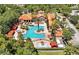 Resort-style pool with lounge chairs and cabanas at 1375 Tuscana Ln # 1106, Davenport, FL 33896