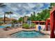 Relaxing pool and spa area with lounge chairs at 1375 Tuscana Ln # 1106, Davenport, FL 33896