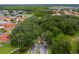 Aerial view of community entrance and surrounding homes at 1017 Park Ridge Cir, Kissimmee, FL 34746