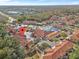 Aerial view showing a townhome with community pool nearby at 1017 Park Ridge Cir, Kissimmee, FL 34746