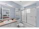 Bathroom with tub shower, toilet and updated vanity at 1017 Park Ridge Cir, Kissimmee, FL 34746