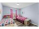 Two twin beds in a Mickey Mouse themed bedroom at 1017 Park Ridge Cir, Kissimmee, FL 34746