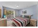 Bedroom with king-size bed and private balcony access at 1017 Park Ridge Cir, Kissimmee, FL 34746