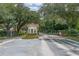 Gated community entrance with guardhouse and landscaping at 1017 Park Ridge Cir, Kissimmee, FL 34746