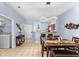 View of dining area, kitchen, and laundry area, light blue walls and tile floor at 1017 Park Ridge Cir, Kissimmee, FL 34746