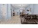 View of dining area and living room, light blue walls and tile floor at 1017 Park Ridge Cir, Kissimmee, FL 34746