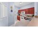Eat-in kitchen features wood cabinets and updated appliances at 1017 Park Ridge Cir, Kissimmee, FL 34746