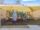 Covered playground with slides and climbing structures at 1017 Park Ridge Cir, Kissimmee, FL 34746