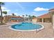 Community pool with ample lounge chairs and shade structures at 1017 Park Ridge Cir, Kissimmee, FL 34746