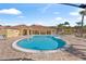 Inviting community pool with surrounding lounge chairs at 1017 Park Ridge Cir, Kissimmee, FL 34746