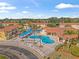 Community pool with surrounding patio and lounge chairs at 1017 Park Ridge Cir, Kissimmee, FL 34746