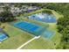 Tennis and basketball courts near a lake at 1017 Park Ridge Cir, Kissimmee, FL 34746