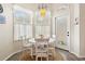 Bright breakfast nook with a round table and white chairs at 121 Longview Ave, Celebration, FL 34747