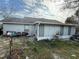 Backyard with a screened enclosure and patio area at 1370 Fern Ln, Daytona Beach, FL 32117