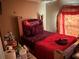 Bedroom with double bed and decorative wall hanging at 1370 Fern Ln, Daytona Beach, FL 32117