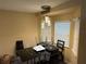 Bright dining area with a glass table and four chairs at 1370 Fern Ln, Daytona Beach, FL 32117