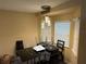Dining area with glass table and bay window at 1370 Fern Ln, Daytona Beach, FL 32117