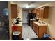 Functional kitchen with wood cabinets and black appliances at 1370 Fern Ln, Daytona Beach, FL 32117