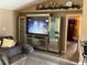 Living room with large TV and entertainment center at 1370 Fern Ln, Daytona Beach, FL 32117