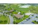 Aerial view of community amenities including clubhouse, pool, and golf course at 1395 Dolphin Head St, Davenport, FL 33896