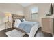 Guest bedroom with a queen bed and a dresser at 1395 Dolphin Head St, Davenport, FL 33896