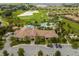 Resort-style community pool with adjacent clubhouse and lush landscaping at 1395 Dolphin Head St, Davenport, FL 33896