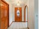 Bright entryway with wood floors and an arched hallway at 1403 Sean Ct, St Cloud, FL 34772