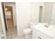 Bathroom with vanity, toilet, and view of bedroom at 14764 Laguna Beach Cir, Orlando, FL 32824