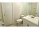 Clean bathroom with white vanity and a large mirror at 14764 Laguna Beach Cir, Orlando, FL 32824