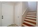 Interior view of a staircase with wooden steps and white walls at 14764 Laguna Beach Cir, Orlando, FL 32824