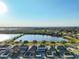 Wide shot of lakefront community at 1493 Reflection Cv, St Cloud, FL 34771