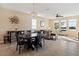 Bright dining area with a charming chandelier and view of the water at 1493 Reflection Cv, St Cloud, FL 34771