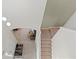 View of staircase overlooking the entryway and living room at 1493 Reflection Cv, St Cloud, FL 34771