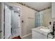 Bathroom with granite countertop, single sink vanity, and shower/tub at 14962 Waterford Chase Pkwy, Orlando, FL 32828