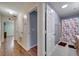Clean bathroom with floral shower curtain and wood vanity at 14962 Waterford Chase Pkwy, Orlando, FL 32828