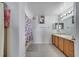 Clean bathroom with double sinks and tub at 14962 Waterford Chase Pkwy, Orlando, FL 32828