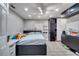 Bright bedroom with a double bed, built-in closet, and wood-look flooring at 14962 Waterford Chase Pkwy, Orlando, FL 32828