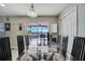 Glass dining table with view of pool and patio at 14962 Waterford Chase Pkwy, Orlando, FL 32828