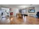 Spacious dining area with hardwood floors and a view into the living room at 14962 Waterford Chase Pkwy, Orlando, FL 32828