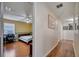 Bright hallway with wood floors and access to bedrooms at 14962 Waterford Chase Pkwy, Orlando, FL 32828
