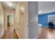 Hallway with wood floors and access to bedrooms at 14962 Waterford Chase Pkwy, Orlando, FL 32828