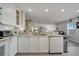 Kitchen with granite countertops, white cabinets, and stainless steel dishwasher at 14962 Waterford Chase Pkwy, Orlando, FL 32828