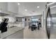 Kitchen boasts granite countertops, stainless steel appliances, and breakfast nook at 14962 Waterford Chase Pkwy, Orlando, FL 32828