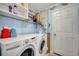 Laundry room with washer, dryer, and shelving at 14962 Waterford Chase Pkwy, Orlando, FL 32828