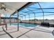 Screened pool area with patio and seating at 14962 Waterford Chase Pkwy, Orlando, FL 32828