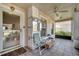 Cozy screened porch with seating and ceiling fan at 14962 Waterford Chase Pkwy, Orlando, FL 32828