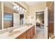 Double vanity bathroom with view into bedroom at 1515 Sunset Pointe Pl, Kissimmee, FL 34744