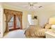 Bright bedroom with balcony access and ample closet space at 1515 Sunset Pointe Pl, Kissimmee, FL 34744