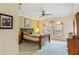 Cozy bedroom with classic wooden bed frame at 1515 Sunset Pointe Pl, Kissimmee, FL 34744