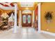 Impressive entryway with high ceilings, decorative columns and a view into dining room at 1515 Sunset Pointe Pl, Kissimmee, FL 34744